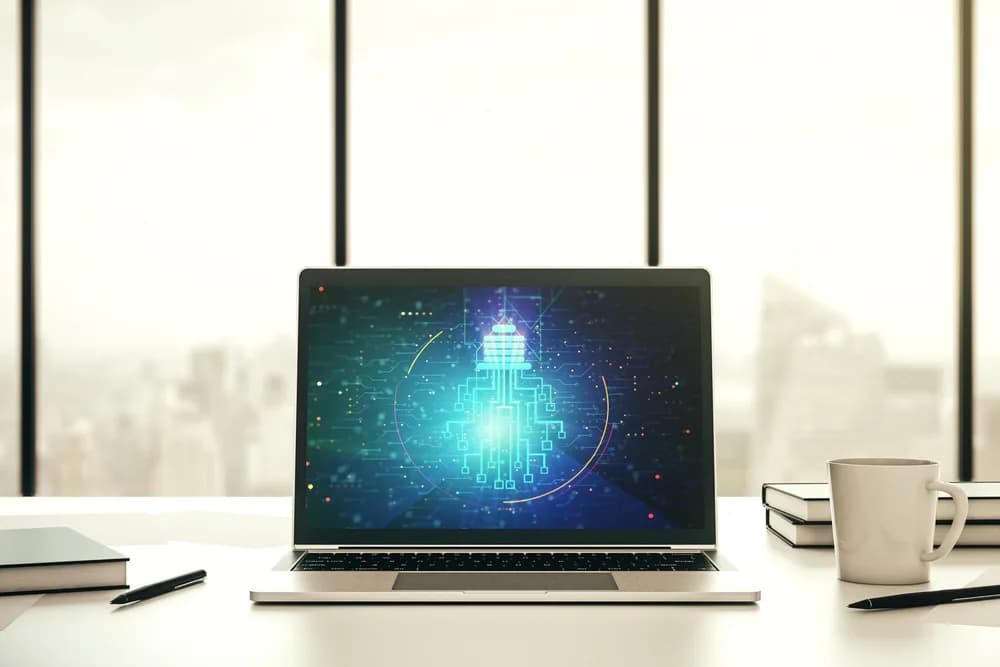 Notebook s rozhraním umělé inteligence na obrazovce.