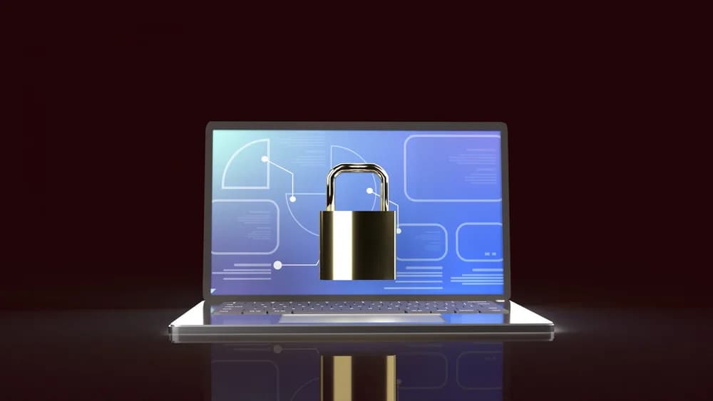 MacBook se zobrazeným bezpečnostním upozorněním.