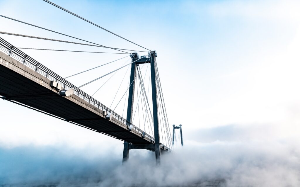 low-angle-view-suspension-bridge-against-sky